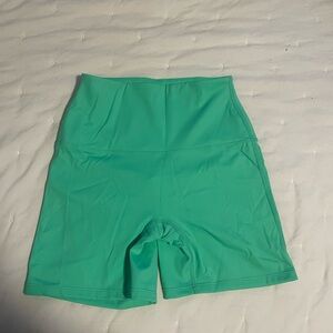 Vibrant Green Bike Shorts with Stretchy Fit and Mid-Thigh Length